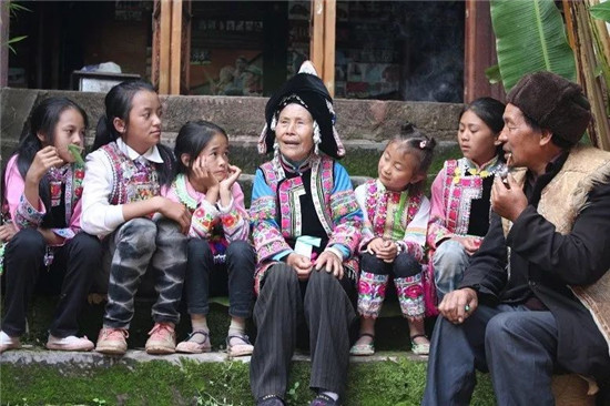A group of Yi people sitting together