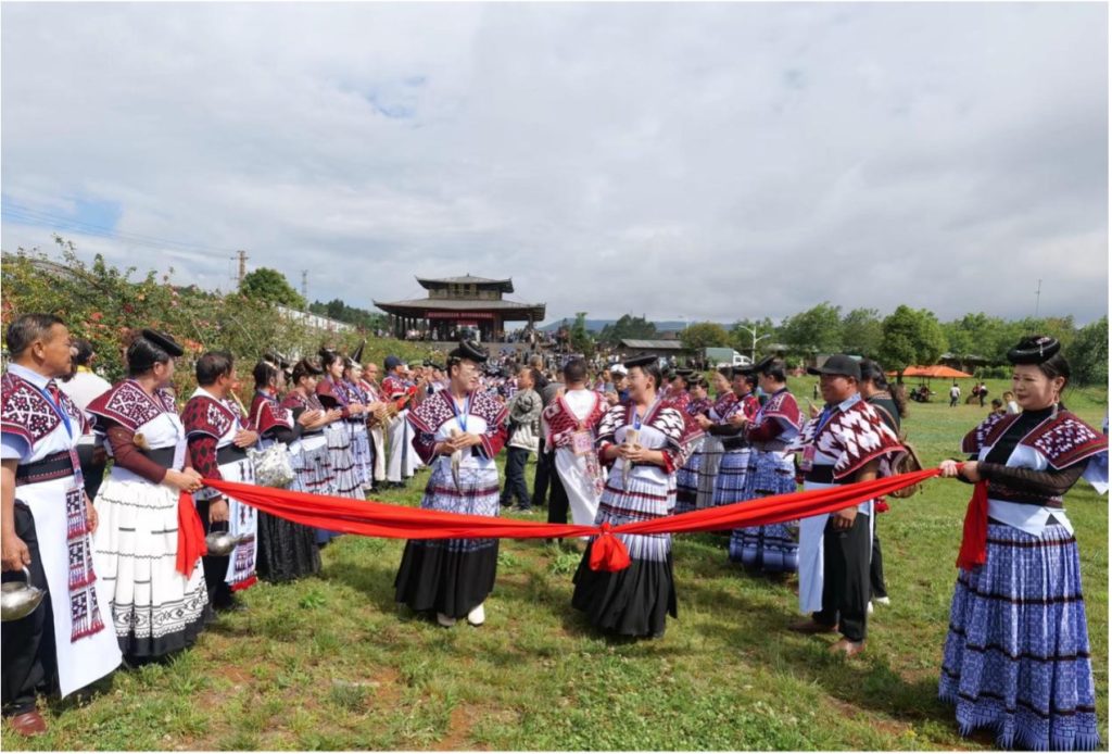The Miao "blocking door wine" (拦门酒) ceremony. June 13, 2026. Photographed by Long Haiyan (龙海燕).